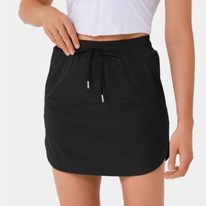 High Waisted Drawstring Side Pocket 2-in-1 Curved Hem Mini Golf Skirt